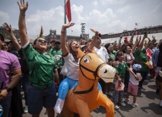 Mexican fans celebrate in a FIFA Fan Fest