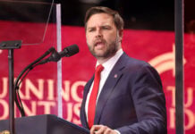 US Vice President JD Vance speaks into a microphone