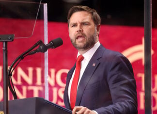 US Vice President JD Vance speaks into a microphone
