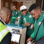 Members of South Africa's soccer team boarding a flight