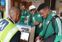 Members of South Africa's soccer team boarding a flight