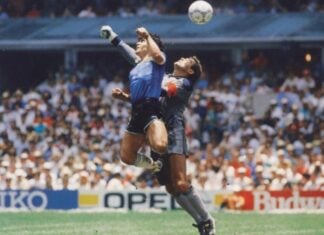 Diego Maradona scoring the "Hand of God" goal against England in 1986