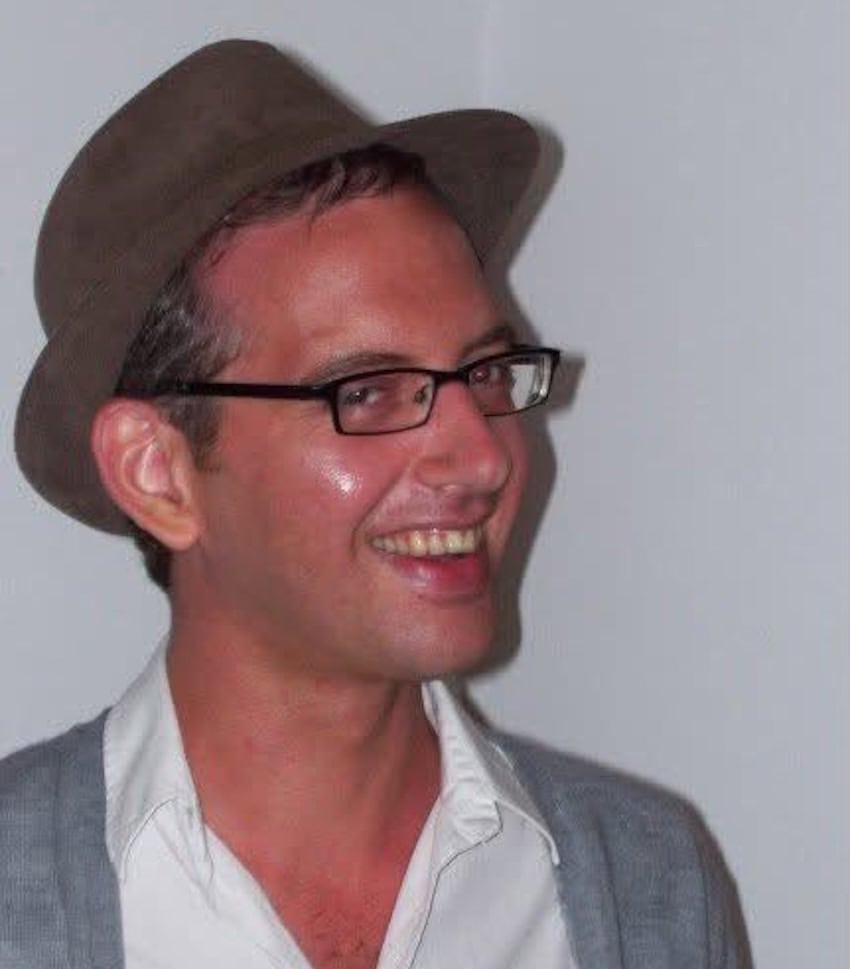 A man in a hat and glasses