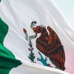 Mexican flag flying in the breeze over Monterrey
