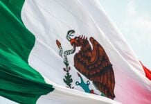 Mexican flag flying in the breeze over Monterrey
