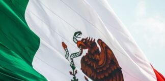 Mexican flag flying in the breeze over Monterrey