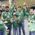 A group of fans in Mexican world cup soccer jerseys in Guadalajara