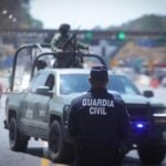 Police standing in front of a road closure