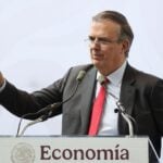 Ebrard at podium