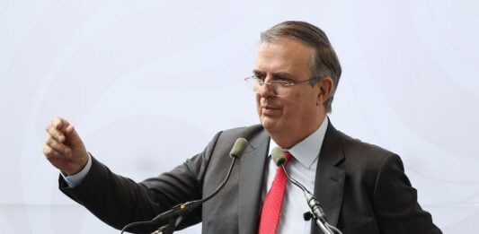 Ebrard at podium