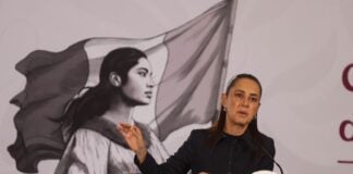 Sheinbaum at podium