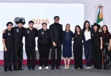 President Sheinbaum poses with the seven U.S.-based semi-finalists of the singing competition México canta at her July 23 press conference.