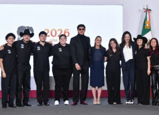 President Sheinbaum poses with the seven U.S.-based semi-finalists of the singing competition México canta at her July 23 press conference.