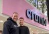 Crumbl co-founders (and cousins) Jason McGowan and Sawyer Hemsley outside a Crumbl bakery