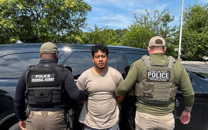 ICE agents detain a "suspect" in New England. (ICE)