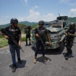 Jalisco New Generation Cartel (CJNG) fighters with an improvised armored vehicle in Aguililla, Michoacán in 2021.