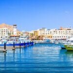 Cabo San Lucas Marina looking at El Tesoro with its distinctive lighthouse feature.