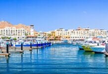 Cabo San Lucas Marina looking at El Tesoro with its distinctive lighthouse feature.