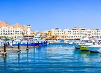 Cabo San Lucas Marina looking at El Tesoro with its distinctive lighthouse feature.