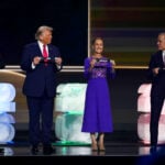 President Sheinbaum holds a plaque reading "Mexico" at the FIFA World Cup draw, alongside Mark Carney, Donald Trump and Gianni Infantino