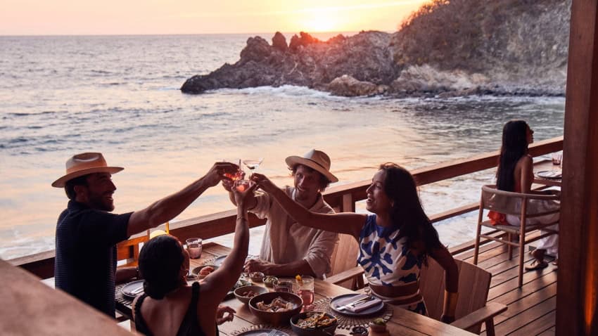 Tourists eating and drinking at Four Seasons Resort Tamarindo in Mexico.