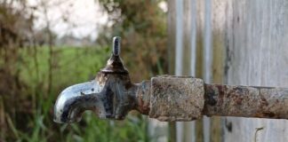 rusted tap slowly dripping