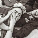 Chavela Vargas and Frida Kahlo laying and laughing together