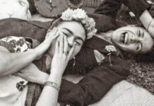 Chavela Vargas and Frida Kahlo laying and laughing together