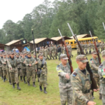 Students march at a militarized grade school in Puebla.