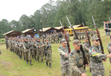 Students march at a militarized grade school in Puebla.