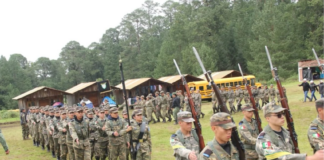 Students march at a militarized grade school in Puebla.