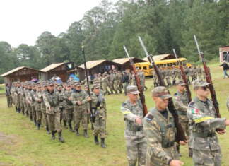 Students march at a militarized grade school in Puebla.