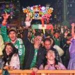 Fans celebrate a goal against Ecuador on Tuesday at the Zócalo fan festival in Mexico City.