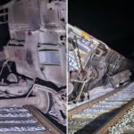 photos show a derailed train at night