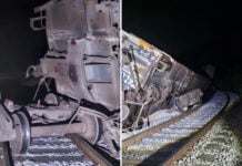 photos show a derailed train at night