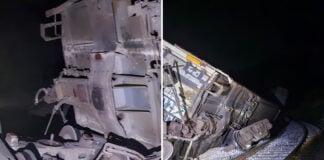 photos show a derailed train at night