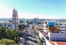 A group of citizens dressed in white protests violence in Sinaloa's state capital of Culiacán.