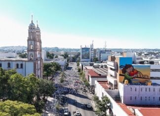 A group of citizens dressed in white protests violence in Sinaloa's state capital of Culiacán.