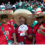 Korean fans wear sombreros reading "Viva Korea" at Guadalajara Stadium at the June 18 match between South Korea and Mexico.