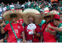 Korean fans wear sombreros reading "Viva Korea" at Guadalajara Stadium at the June 18 match between South Korea and Mexico.