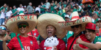 Korean fans wear sombreros reading "Viva Korea" at Guadalajara Stadium at the June 18 match between South Korea and Mexico.