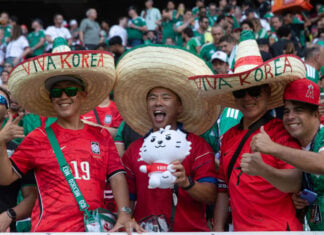 Korean fans wear sombreros reading "Viva Korea" at Guadalajara Stadium at the June 18 match between South Korea and Mexico.