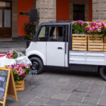 The Olinia Carga electric vehicle, filled with flowers