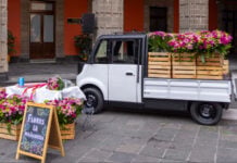 The Olinia Carga electric vehicle, filled with flowers