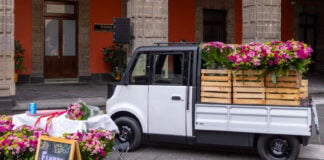 The Olinia Carga electric vehicle, filled with flowers