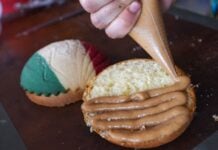 A pastry chef puts the finishing touch on patriotic sweet bread.