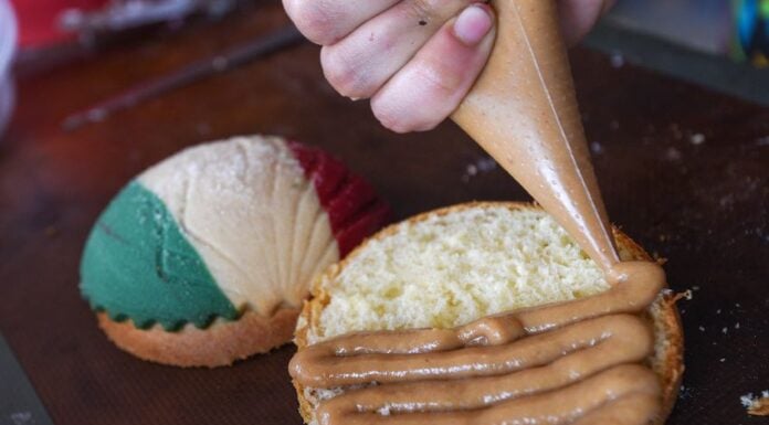 A pastry chef puts the finishing touch on patriotic sweet bread.