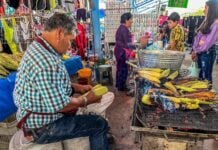 A man serves elote, or roasted corn on the cob, in San Miguel de Allende, Mexico.