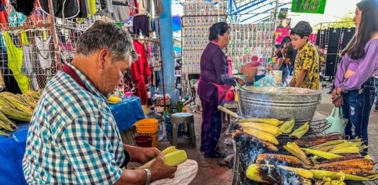 A man serves elote, or roasted corn on the cob, in San Miguel de Allende, Mexico.