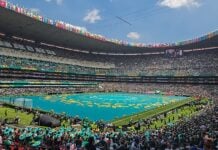 Mexico City’s main stadium, full of green, ahead of World Cup opening ceremony.
